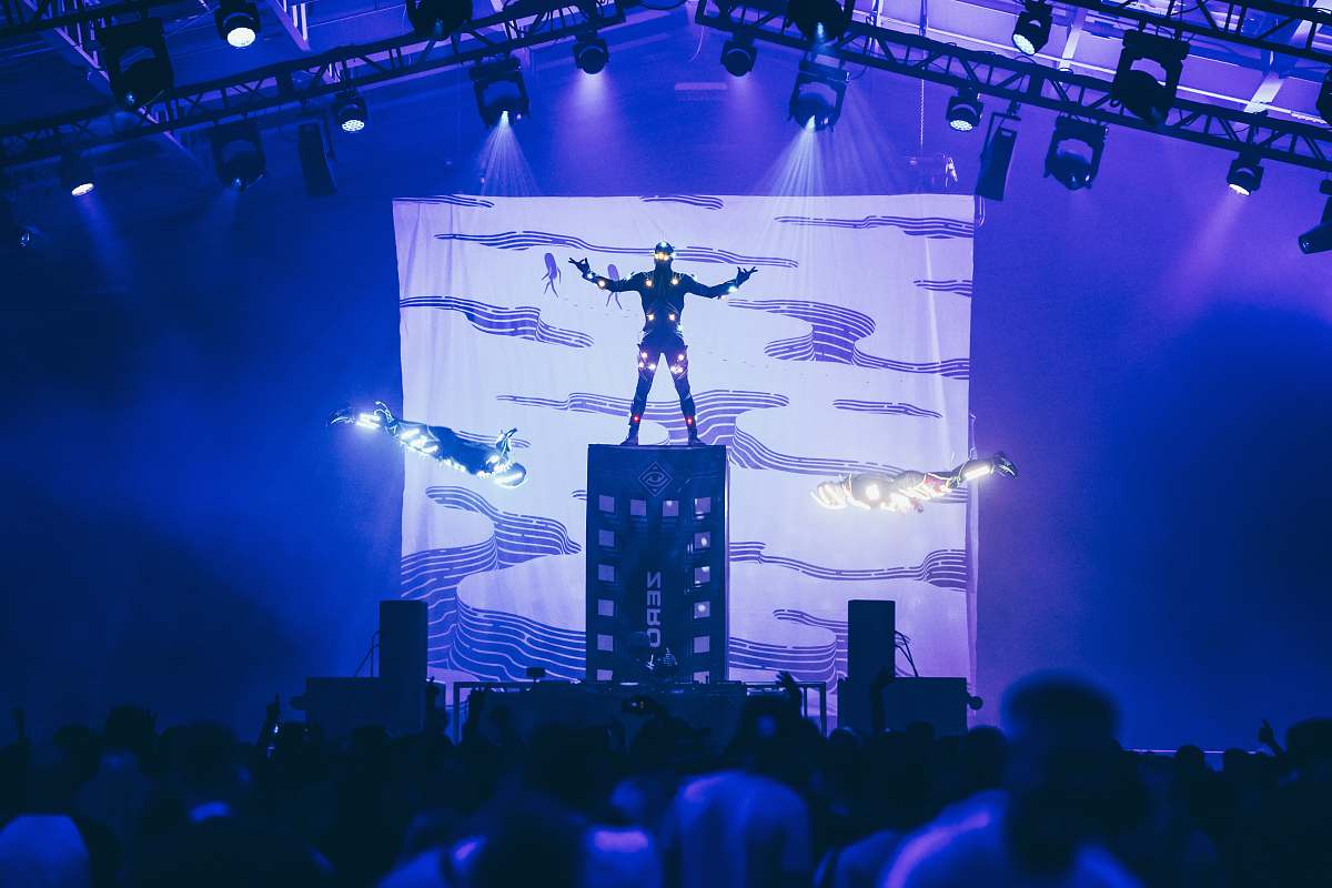 leisure activities man standing on stage with lights stage